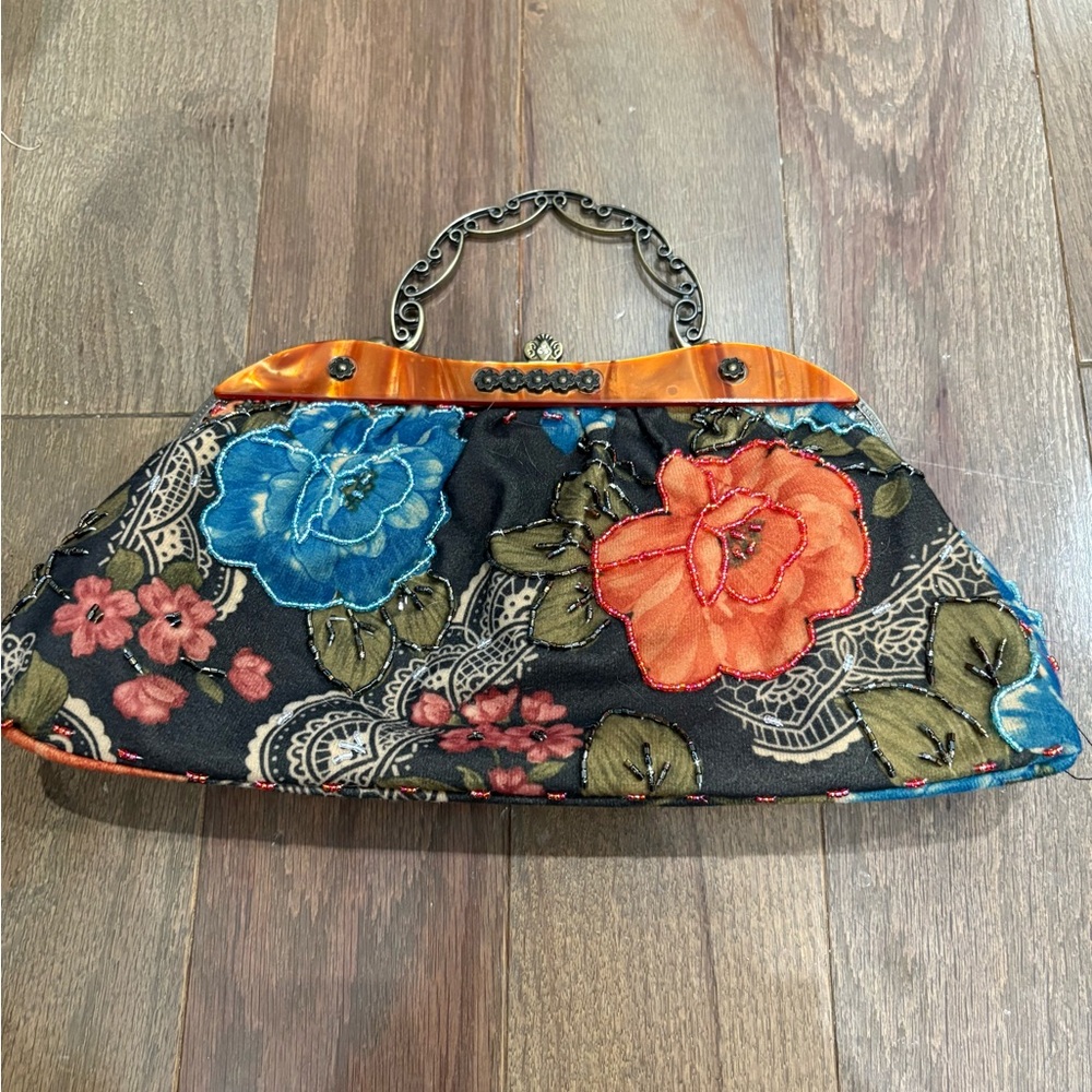 Vintage beaded floral purse with a carved brass handle!